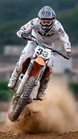 A person riding a dirt bike photo
