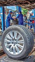 A tire on a car in a garage photo