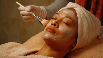 A woman getting facial treatment photo