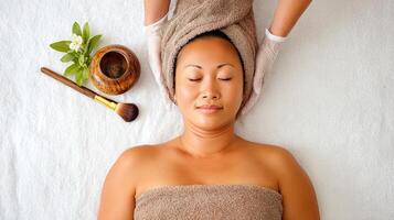 A woman getting a facial massage at a spa photo