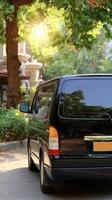 A black van parked on a street photo