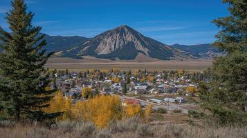 A view of a town with a mountain in the background photo