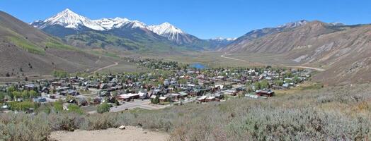 A view of a small town in the mountains photo