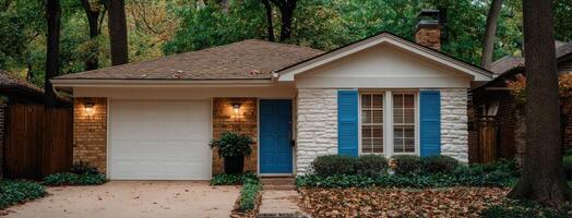 A small house with blue shutters and a white door photo