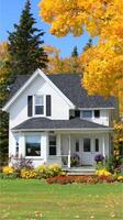 A white house with a black roof and yellow leaves photo