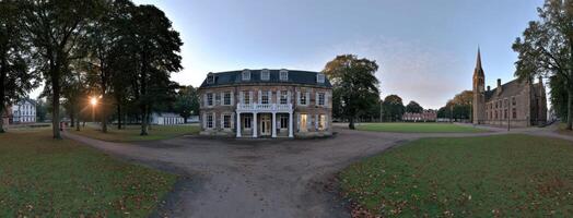 A 360 - view of a park with a building in the middle photo