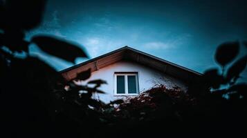 A house with a window in the dark photo