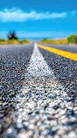 A road with a yellow line on the side photo