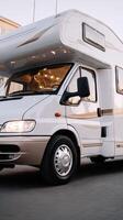 A white motor home parked on the street photo