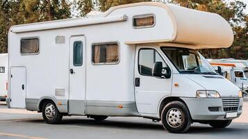 A white rv parked in a parking lot photo