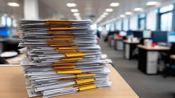 A stack of papers on a desk in an office photo
