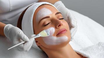 A woman getting facial treatment at a spa photo