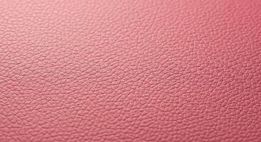 A close up of a pink leather surface photo