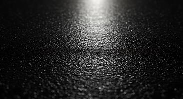 A black and white photo of a shiny surface