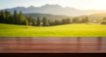 Table top on a green field with mountains in the background photo