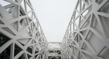 A white building with geometric shapes on the outside photo