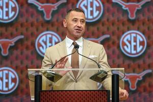 Texas Longhorns head coach Steve Sarkisan talks to the media during SEC Media Days at Omni Atlanta Hotel. editorial_image