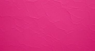 A pink wall with a texture of paper photo