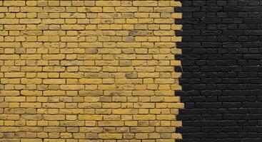 A black and yellow brick wall with a black and white stripe photo