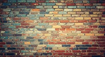 An old brick wall with a lot of paint on it photo