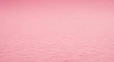 A pink background with a small amount of snow photo