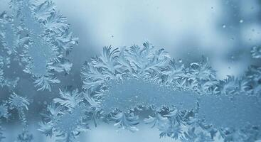 Frosty glass with snowflakes on it photo