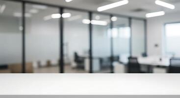 Empty table in an office with blurred glass walls photo