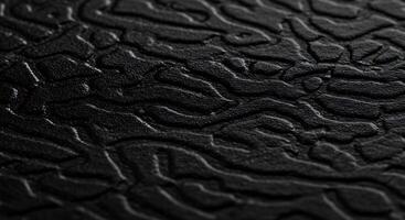 A black leather surface with a pattern of small dots photo