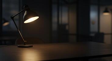 A desk lamp is on a table in a dark room photo