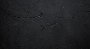A black wall with cracks and a black paint photo