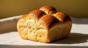 A loaf of bread sitting on top of a cloth photo