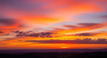 A sunset over a hill photo