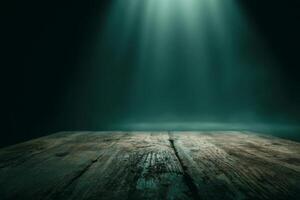 Empty wooden table surface under dramatic green light in dark background photo