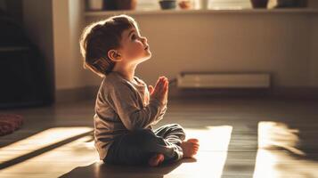 toddler praying in sunlight photo