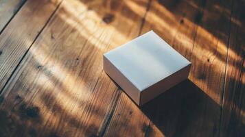 white gift box on wooden surface photo
