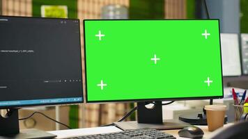 Technology company workspace with chroma key computer used to conduct code reviews, fixing bugs. Isolated screen PC on office desk used to design and implement algorithms video