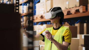 Worker uses virtual reality headset to ensure order fulfillment with AI, tracking parcel status for e-commerce logistics. Asian man in industrial depot with racks and boxes. Camera B. video