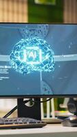 Vertical PC in empty IT startup office displaying artificial intelligence programming languages used for building applications. Computer showing machine learning code in software development agency video
