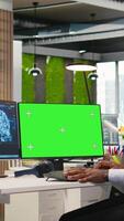 Vertical Engineer writing code on green screen PC, developing machine learning APIs. IT expert using mockup PC to troubleshoot software errors using artificial intelligence, camera A video