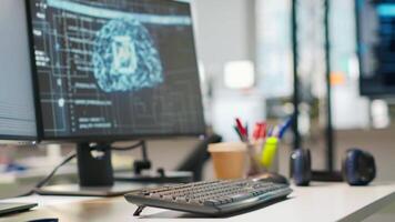 Empty startup office with artificial intelligence neural networks program running on PC displays used by programmers. AI company workspace computers leveraging deep learning technology video