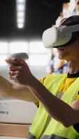 Vertical Staff wearing a VR headset for 3D simulation powered by artificial intelligence, supporting order processing and inventory control. Monitoring real time shipment parcel tracking. Camera B. video