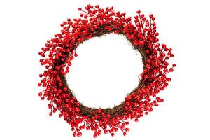 Christmas wreath made of artificial red berries branches for home decoration, on a white background photo