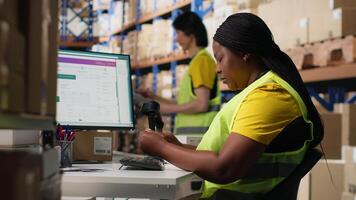 Warehouse supply and demand operations for package tracking, checking shipment details for fast delivery service. Handling merchandise registration for inventory control in big depot. Camera B. video