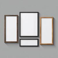 Three empty wooden frames on a gray wall photo