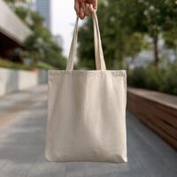 A person holding a tote bag mockup photo