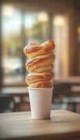 Puff pastry twist baked on white paper cup disposable story background photo