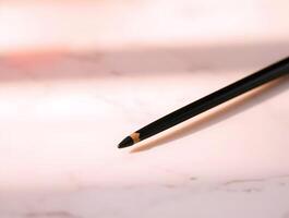 Precision Elegance CloseUp of a Fine Black Pen on Marble photo