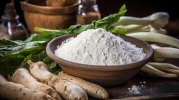 Flour in a bowl with roots and greens. photo