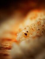 Close up of sushi rice grains with toasted sesame seeds, shallow depth of field. photo