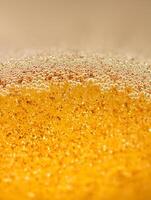 Close up of Golden Bubbles and Sparkle Texture Abstract Background Image. photo